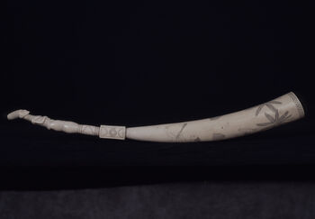 Museum number: UEM22753&amp;#160;
Material: Ivory&amp;#160;
Region and culture: Haut-Uele, Mangbetu-people&amp;#160; &amp;#160;
Description:&amp;#160;Belongs to the Mangbetu-people from Haut-Uele. The edge of the tooth is in the shape of a carved female figure. The remaining part of the ivory tooth displays different incised scenes that illustrates palm trees, male and female figures. One of the men is climbing a palm tree with the help of a rope. Some of the women are chopping down a palm tree using axes. This ivory tooth shows signs of both a strong Congolese artistic tradition and aesthetic adjustments to possible foreign buyers. Length 59 cm.&amp;#160;&amp;#160;
Lawyer Jacob Vogt delivered the object to the museum.&amp;#160;Unknown date.&amp;#160;