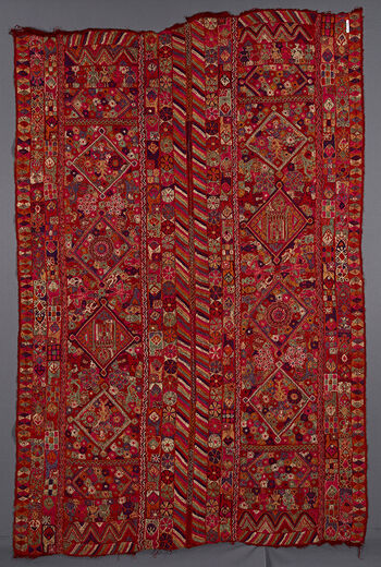 (UEM49193) Characteristic multi-colored diagonal lines pattern only on the inner vertical edges of the two panels. Diamond pattern on the outer edges. Motifs: big diamonds, flowers, girls in a row. Possibly four blond mermaids on each panel, camel riders, garlanded figures, vases, and possibly two mihrab/mosques on each panel.&amp;#160;