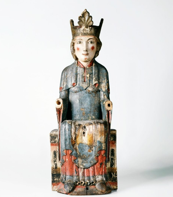 This Madonna statue originally comes from Hovland Stave Church in Eggedal. The old stave church was demolished in 1881 and three sculptures were therefore given to the museum by local authorities. One of these is this Mary with the child, or a “Madonna”. Mary had an enormous significance in the development of the popular, religious life of the Middle Ages. She has been a main motif in ecclesiastical painting, especially icon painting, but also painting more generally. The Madonna figure is dated to 1160-1200, and is made of alder and birch. Height: 56.7 cm. Width: 21 cm. Depth: 13.6 cm.&amp;#160;C10785.