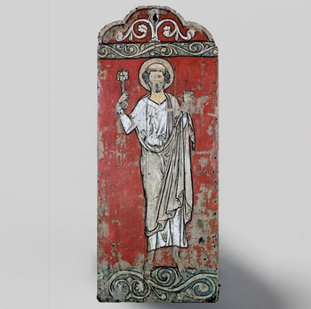 This painted tabernacle wing from Fåberg, Oppland, portrays St. Peter with the keys of Heaven. His bright appearance on the red background is strengthened by a halo around his head, and delicate bands of curvy plant ornamentation on blue background. The exceptional painting of St. Peter is on the exterior of the door of a closed shrine. Through him, people could learn to know the Heavenly pleasures. The inside of the door holds traces of relief figures expressing motifs from Mary’s life, which may indicate that a sculpture of Mary may have appeared as the central figure in the tabernacle. The painted door panel dates to the mid-thirteenth century and is extra-ordinary both in style and in quality. The door panel has recently been on loan for the exhibition North &amp;#38; South: European masterpieces reunited at the Museum Catharijneconvent in Utrecht, the Netherlands (October 2019 - January 2020), and then at the Episcopal Museum of Vic in Barcelona, Spain (February 2020-September 2020).&amp;#160;C3006.