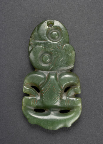 Museum number: UEM144 a&amp;#160;&amp;#160;
Material: Jade/semiprecious stone
Region and culture: Hokianga, New Zealand - Maori&amp;#160;&amp;#160;
Description: Pendant or&amp;#160;hei tiki. 9,4 cm. The hei tiki is a very stylised representation of the human form. Usually considered either female or genderless.&amp;#160;The splayed hips, sometimes dilated vulva, bulging eyes and hands akimbo is considered to be representations of a woman in childbirth and thus the object can also be associated with gods of fertility.&amp;#160;Made from jade (nephritt), these antropomorphic pendants are considered one of the most valuable&amp;#160;taonga&amp;#160;(treasured possesion) amongst the Māori. Jade is commonly found on the South Island of&amp;#160;Aotearoa, New Zealand, yet the hei tiki is usually associated with the North Island. Due to the valuable nature of the hei tiki, the object is usually connected with the upper class amongst Māori, giving the object&amp;#160;mana&amp;#160;(power). Though not precisley dated, the hei tiki can be traced back to the Classical Māori period (Te Puawiatanga, 1500-1800).&amp;#160;&amp;#160;&amp;#160;
The object was collected by Fredrik Ring in Valparaiso, Chile in the 1820s. Konsul Ring donated the object to the Ethnographic Museum in 1833.&amp;#160;&amp;#160;