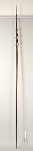 Museum number: UEM188
Material: Wood
Region and culture: Produced on Fiji, collected in New Zealand&amp;#160;
Description:&amp;#160;Wooden spear measured at 3,48 meter in length. Appears to be a throwing-spear (moto) from Fiji, produced sometime between the late 18th century and early 19th century. The entire spear is carved from a single piece of wood and the tip of the spear is characterized by its long and heavy barbs. These types of spears are known as gadregadre, which translates to &quot;lust&quot; or &quot;desire&quot; and were considered to be one of the most important weapons amongst Fijians. Yet, these types of spears were also symbols of authority, masculinity and the approvement of ancestral gods. Spears (and clubs) played an important role in dance performances. It is unclear where in Fiji this spear originates from.&amp;#160;&amp;#160;