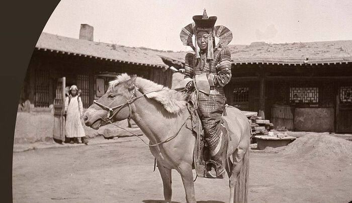 Black and white photo of a Mongolian on horse