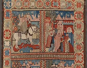 Et fargerikt teppe med motiv av tre konger som rir på hester.